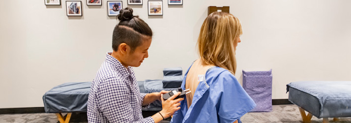 Chiropractor American Fork UT Debbie Pun Listening To Patient